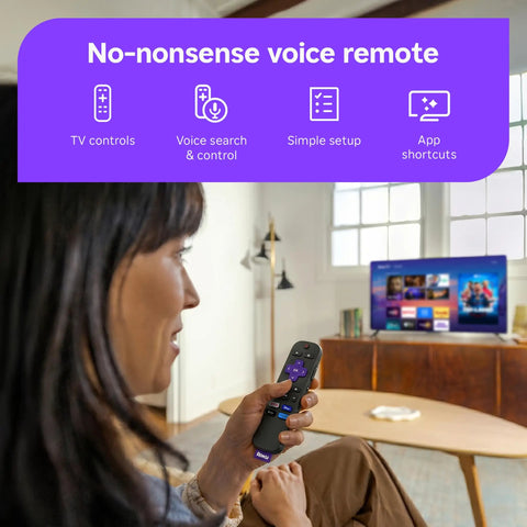 User holding no-nonsense voice remote with Sleek 32 Inch Full H d Smart Television in background, ideal for easy streaming.