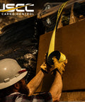 Worker securing load with Two Pack 4 Inch Ratchet Straps 27 Foot With Flat Hooks And Built In Defenders Beefy Yellow Polyester Tie Downs