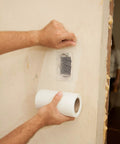Applying Onetime Fiber Mesh Crack Patch Wall Repair Fabric 6 Inch By 75 Foot Self Adhesive on drywall corner