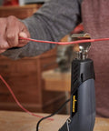 Person using All In One Dual Temperature Electric Heat Gun Kit HT400 680F And 450F for wire repair with shrink tubing