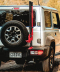 Rust-Resistant Hi-Lift Jack Handle Keeper Accessory Upgrade Bar Protector mounted on SUV rear for secure transport.