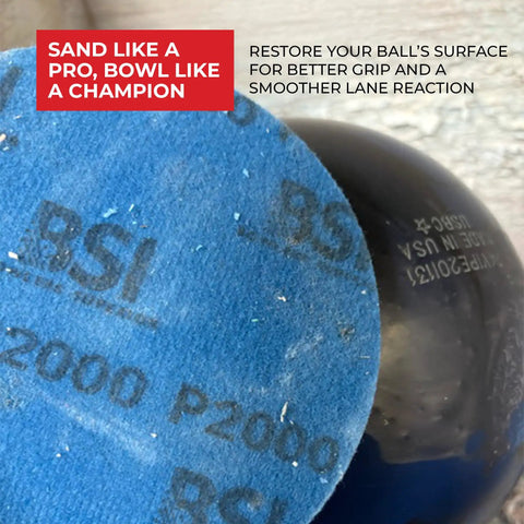 Close-up of 1000 Grit Bowling Ball Sanding Disc Kit for Resurfacing Machines Ball Spinner and Hand Cleaning Pro Grade Pad in use.