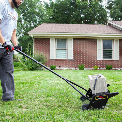 Person using 20 Inch Premium Push Spike Aerator With 3D Galvanized Steel Tines And Weight Tray For Deep Core Penetration on lawn.