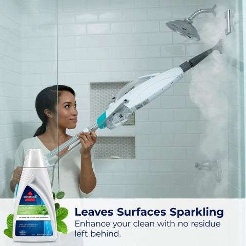 Woman using steam mop with Eucalyptus Mint Demineralized Steam Mop Water, 32 Oz, White, Fresh Scent Cleaning Solution For Steam Mops, Model 1392