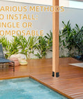Installed Four Pack Post Anchor Base Set Black Powder Coated Deck Post Brackets for 4x4, 6x6, 8x8 posts in a patio setting