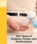 Person holding a Triple Calcium Bone Support Stack With Vitamin D3 And Key Minerals For Strong Bones supplement bottle.