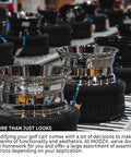 Sick Glossy White Steel Golf Cart Wheels And Durable Turf Replacement Tires Set Of Four displayed in warehouse setting.