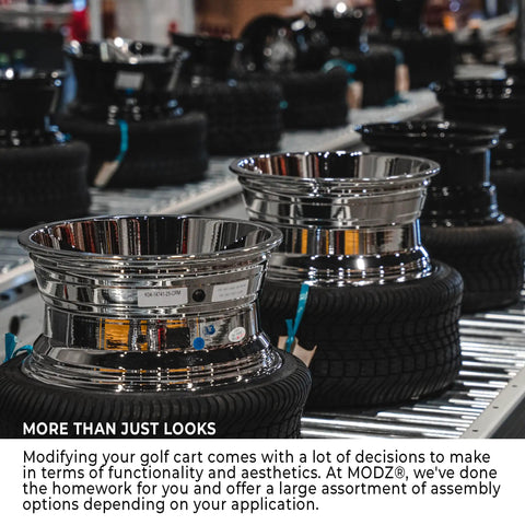 Sick Glossy White Steel Golf Cart Wheels And Durable Turf Replacement Tires Set Of Four displayed in warehouse setting.