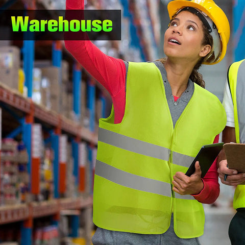Person wearing a Bulk High Visibility Safety Vest For Construction And Outdoor Work in a warehouse, holding a clipboard.