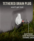 Tethered drain plug on Classic Series Insulated Portable Cooler With Leak Resistant Build Keeps Ice For Days, shown on grass