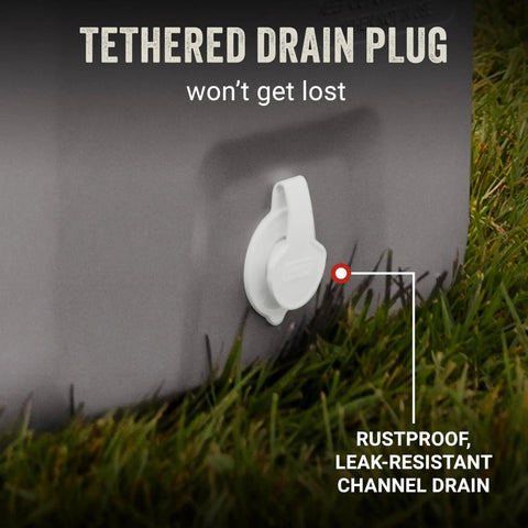 Tethered drain plug on Classic Series Insulated Portable Cooler With Leak Resistant Build Keeps Ice For Days, shown on grass