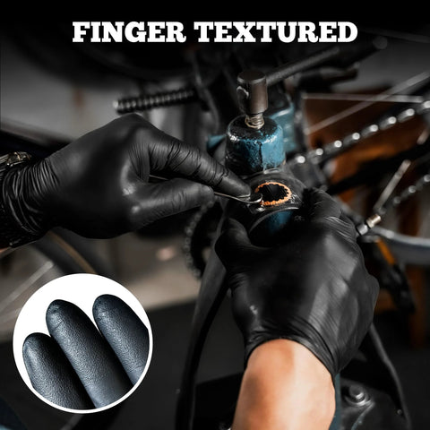 Black nitrile disposable gloves with textured fingertips; close-up of bicycle repair.