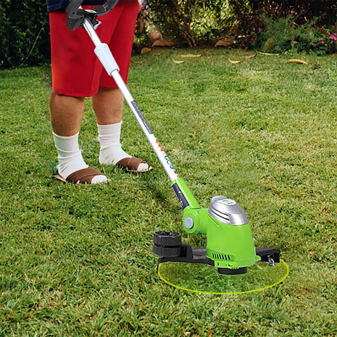 Green trimmer with Weed Eater Spools Replacement For Greenworks Trimmers 20V 24V 40V 16 Ft 0.065 Inch Line in use on lawn