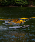 Carbon Cub 15cc ARF Ready To Fly RC Plane with laser-cut all wood construction on water with float attachments.