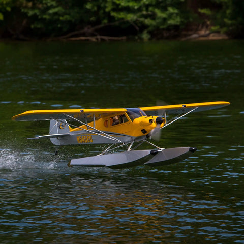 Carbon Cub 15cc ARF Ready To Fly RC Plane with laser-cut all wood construction on water with float attachments.