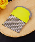 Crinkle cutter knife with yellow handle and gray grip; stainless steel comb blade for slicing vegetables into fries.