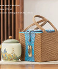 Top Shelf Ceramic Tea Tin With Woven Rattan Travel Case, Stunning Mountain Landscape Design, Go To Stash Jar For Loose Leaf Tea Or Specialty Coffee Beans In Slate Blue next to woven rattan travel case.