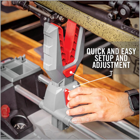 Close-up of One-Hand Clamp Gun Workstation With Non-Marring, Form-Fitting Yokes And Leveling Knob during rifle setup.