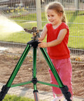 Child adjusting Beefy Impact Sprinkler Head On Tripod Base For Lawn Irrigation, Heavy Duty 360 Degree Coverage with Metal Nozzle, 2 Pack