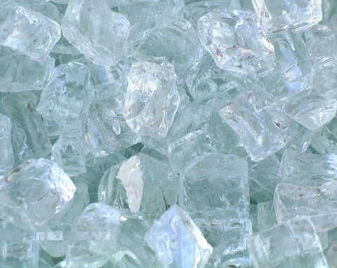 Close-up of white fire glass pieces for outdoor propane fire pit table top with 40,000 BTU, 30x30 inch square tile top.