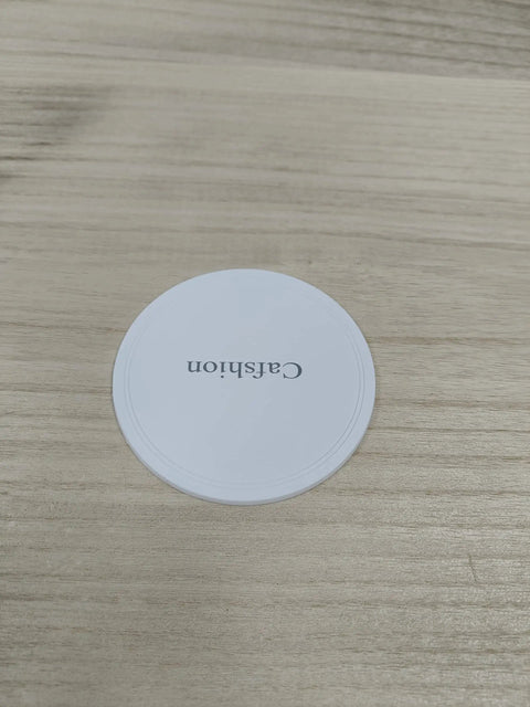 Heavy Duty Furniture Moving Sliders And Round Glide Pads For Carpet Hardwood Floors, round white pad on wooden surface.