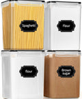 Large Airtight Food Storage Canisters Set 4 Pack 5.2L BPA Free Pantry Containers With 20 Labels And Marker For Flour Sugar Baking Supplies Organize Like A Pro In Your Kitchen showing labeled containers with spaghetti, flour, and brown sugar.