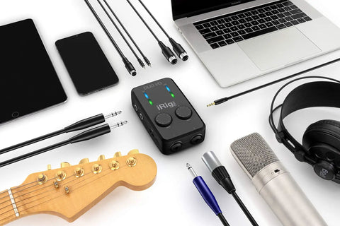 iRig Pro Duo IO USB Audio Interface Dual Channel 24 Bit With TRS Balanced Outputs and recording equipment on desk.