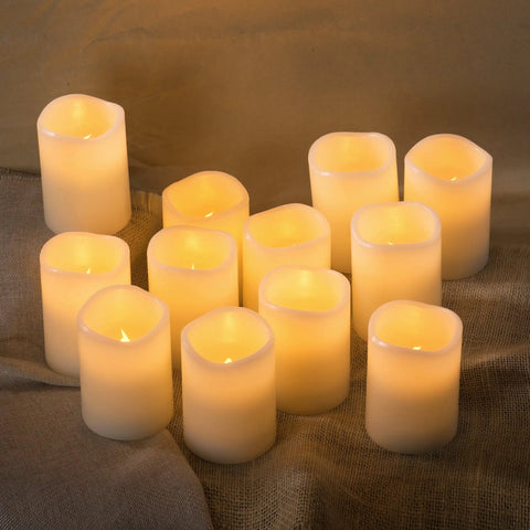 12 Pack Flameless Candles With Real Wax Battery Operated LED Pillar Candles Unscented Ivory Color Including Remote Control And 24 Hour Timer Diameter 3 Inches Height 4 Inches Perfect For Cozy Home Vibes Parties Weddings And Events arranged in a group