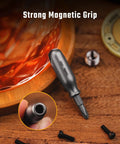 Rock Solid Premium Titanium Mini Screwdriver Featuring Super Magnetic Replaceable Bits And Rapid Phillips Flathead Swaps For Trustworthy Daily Use Everywhere with strong magnet on wooden surface.