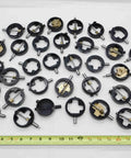 Assorted Dial Test Indicator Spare Parts Bundle Plug And Play For Precision Machine Repair Featuring Rock Solid Replacement Gears Dials And Workbench Hardware Pack, close-up of black gears and dials, measuring length with ruler.