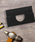 Heavy Duty Angle Grinder Holder Wall Mount Organizer in black iron with tools on wooden surface