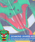 Close-up of green long snake kite with gold foil detailing featuring snake face design and vibrant colors.