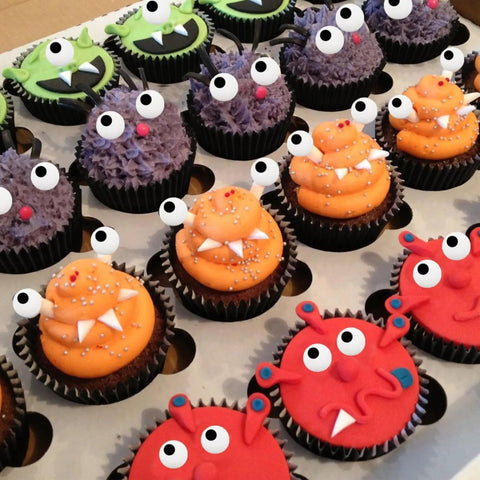 Monster-themed cupcakes with Big Edible Candy Eyeballs 10 Mm For Bold Decorating Pack Of 2 Jars 3 Oz Each Total 6 Oz Ideal