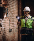 Worker inspects brick wall with PolyTac X 600 Lumen Tactical LED Flashlight With Ten-Tap Programmable Modes, 11,485 Candela, 205 Meter Beam