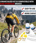 Cyclist on mountain trail with Magura Hydraulic Brake Bleed Kit including 120ml mineral oil, two syringes, adapters.