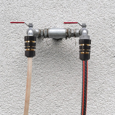 Installed Three Quarter Inch Garden Hose Quick Connectors Kit, Aluminum Male And Female Quick Connect Fittings showing two hoses attached