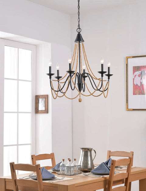 Escapade Six Light Chandelier In Oil Rubbed Bronze With Wood Bead Accents For Casual Dining Rooms Elegant Curves And Lit Ambient Lighting In A Modern Farmhouse Vibe over dining table