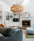 Large Handwoven Rattan Chandelier For Dining Room Boho Chic Pendant Light With Gold Plated Cylinder Rod casting dreamy shadows in living room.