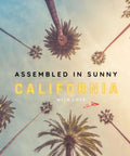 Tall palm trees with a sky background and overlay text 'Assembled in Sunny California with Love'.