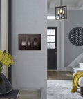 Radiant 450W Preset Decorator Rocker Dimmer Switch With LED Locator in dark bronze finish on living room wall