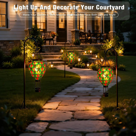 Mosaic Glass Hot Air Balloon Solar Lanterns With Flickering Flame Effect illuminating garden path at night