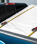 Heavy Duty Ratchet Tie Down Straps 4 Pack 16 Ft By 1.5 Inches securing a load in a truck bed with rubber soft J hooks.