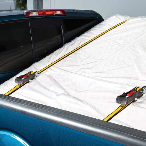 Heavy Duty Ratchet Tie Down Straps 4 Pack 16 Ft By 1.5 Inches securing a load in a truck bed with rubber soft J hooks.