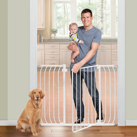 Man holding baby with dog beside Multi-Use Extra Tall Walk Through Baby Gate In Metal White Finish, 36 Inch Tall, Fits Openings From 29 To 48 Inches Wide, Perfect Baby And Pet Gate For Doorways And Stairways, Easy Install With Quick Mount Kit