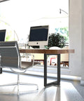 Modern office with Beefy Heavy Duty T Shape Metal Table Legs 28x24 Inch Industrial Desk Legs Set Black 2 Pack with computer setup.