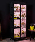Mini Indoor Greenhouse With 18W T8 Grow Lights And Digital Thermo Hygrometer, 27 By 15 By 70 Inches Smart Grow Tent in use