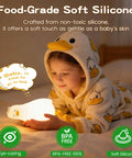 Child holding a Squishy Silicone Rubber Duck Night Light For Nursery Baby And Kids Dimmable Rechargeable Touch Led Lamp BPA Free Non Toxic Bedside Light For Breastfeeding and Shatterproof Safe Cozy Glow, wearing duck-pattern pajamas in a dimly lit room.