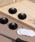 Premium Self Adhesive Caster Wheels For Furniture Legs Featuring A Rock Solid 360 Degree Low Profile Swivel Design Made From Heavy Duty Abs And Brushed Stainless Steel In Matte Black lay on wood with screws.