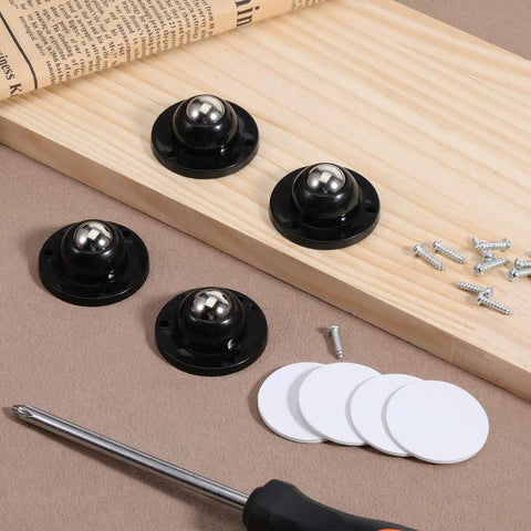 Premium Self Adhesive Caster Wheels For Furniture Legs Featuring A Rock Solid 360 Degree Low Profile Swivel Design Made From Heavy Duty Abs And Brushed Stainless Steel In Matte Black lay on wood with screws.