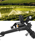 360 Degree Rocking Arm And Impact Irrigation Sprinkler With Adjustable DN25 Female Thread, black plastic, in field setting